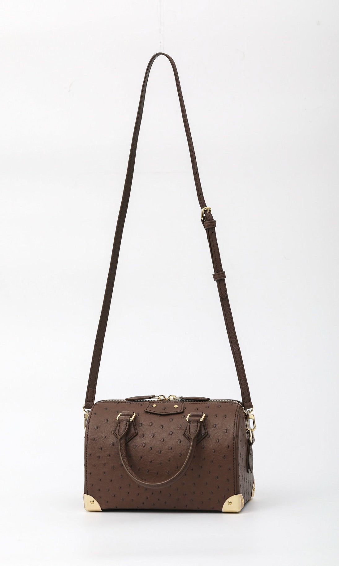 Women's genuine ostrich skin leather handbag with top handle and pillow design by Rossie Viren, featuring textured black leather.