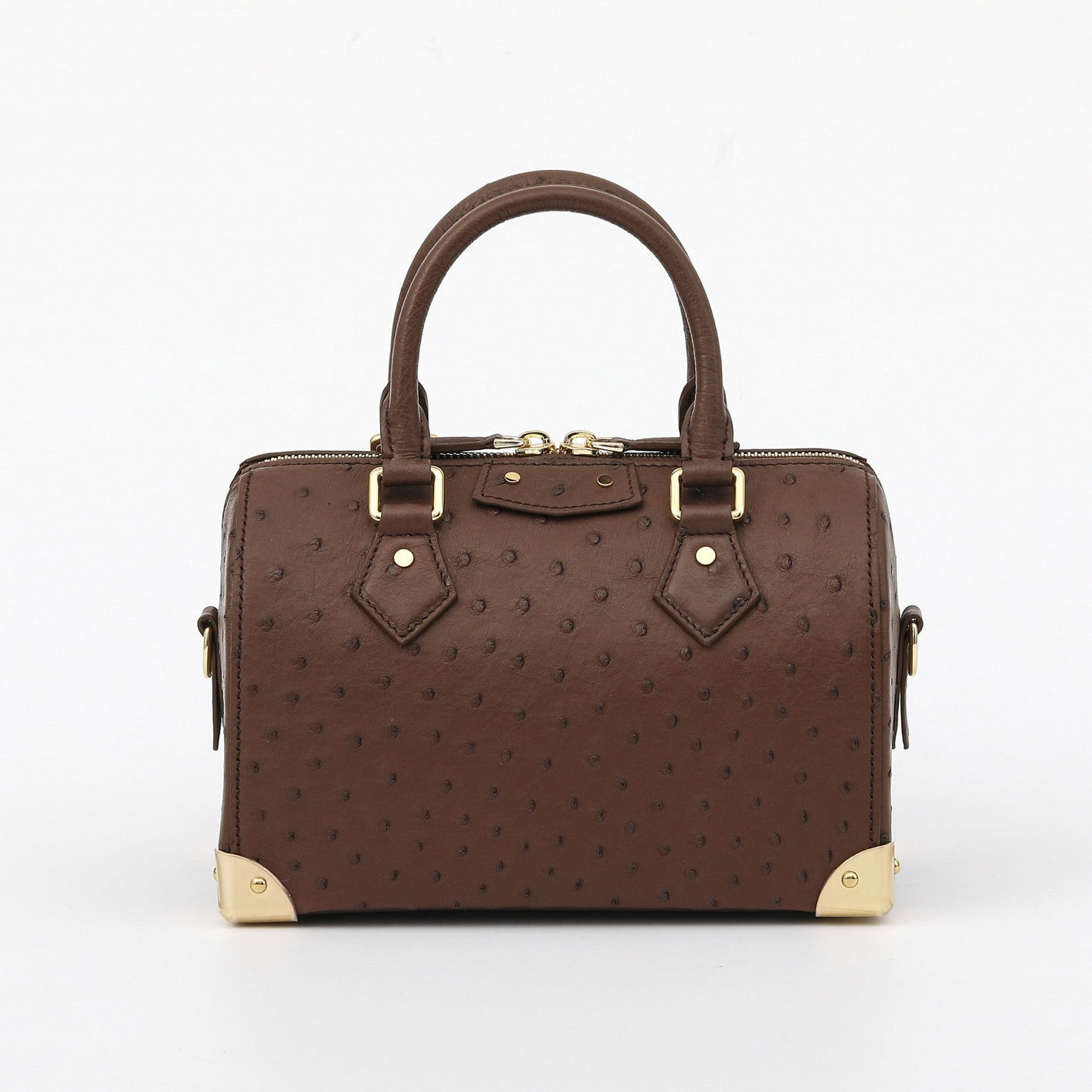 Women's genuine ostrich skin leather top handle pillow bag by Rossie Viren, featuring a soft, textured leather design with a structured shape.
