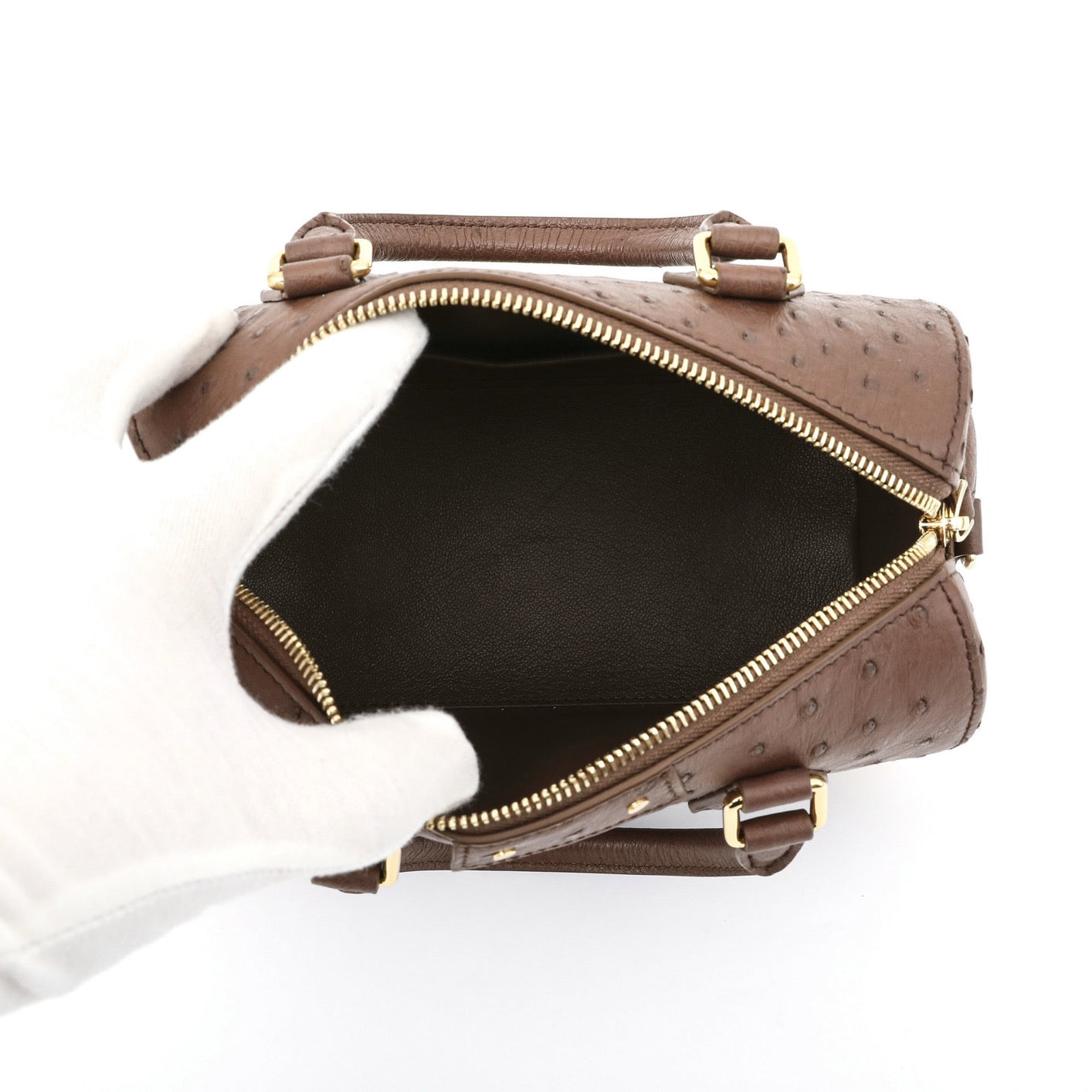Women's genuine ostrich skin leather top handle pillow handbag by Rossie Viren, featuring a sleek and textured design with a top handle.