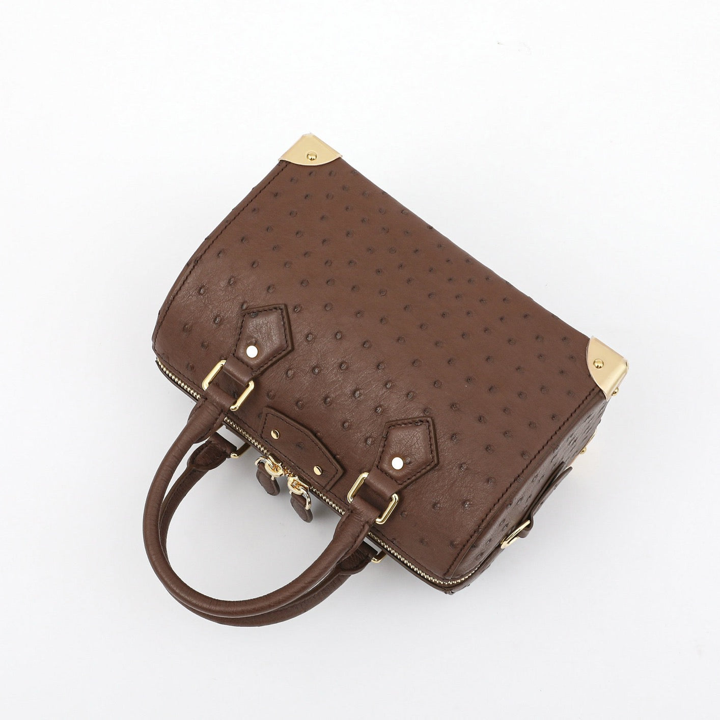 Women’s genuine ostrich skin leather top handle handbag by Rossie Viren, showcasing its elegant pillow design and textured surface.