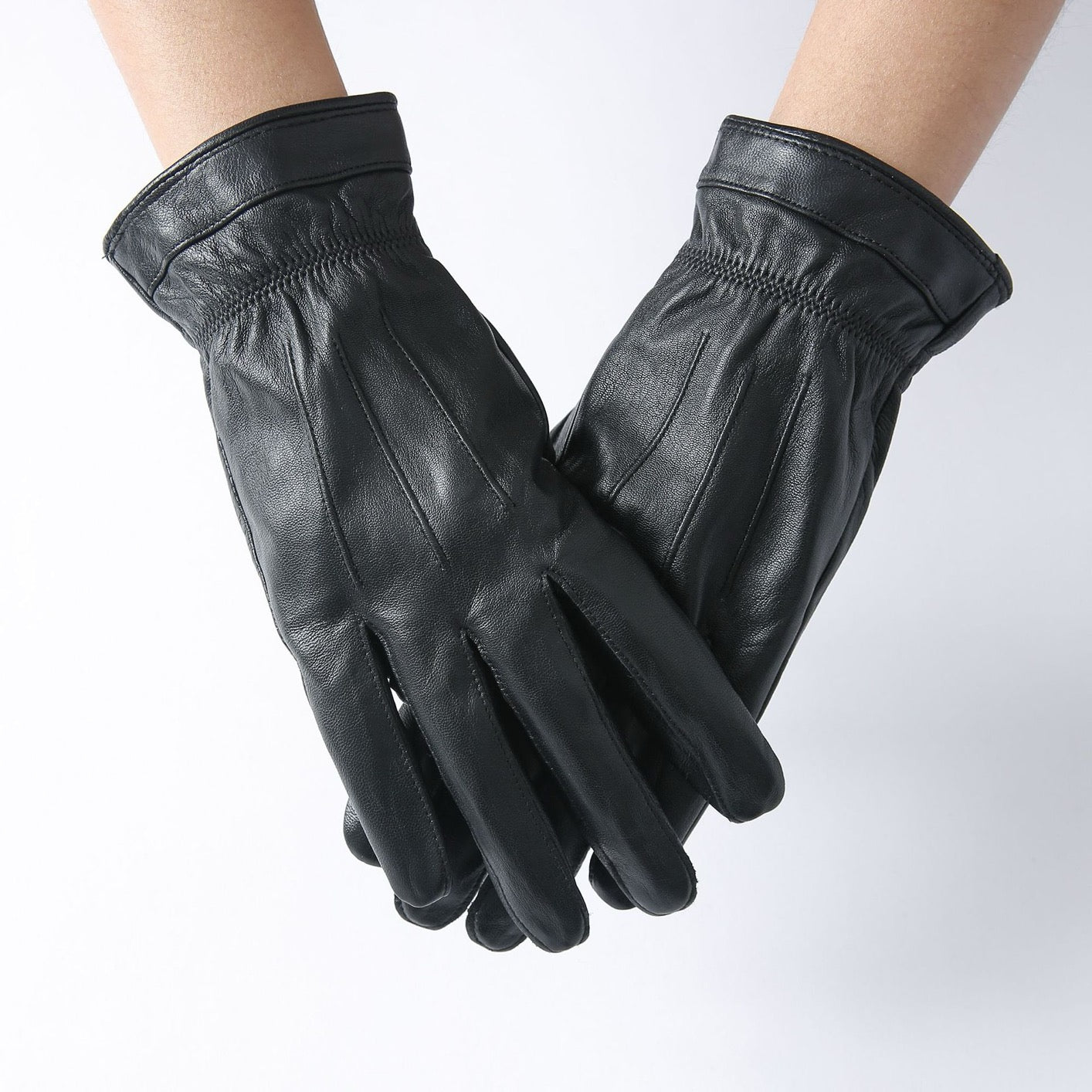 Black men's leather gloves by Rossie Viren, stylish basic handbag with smooth leather finish, shown with the gloves displayed prominently.