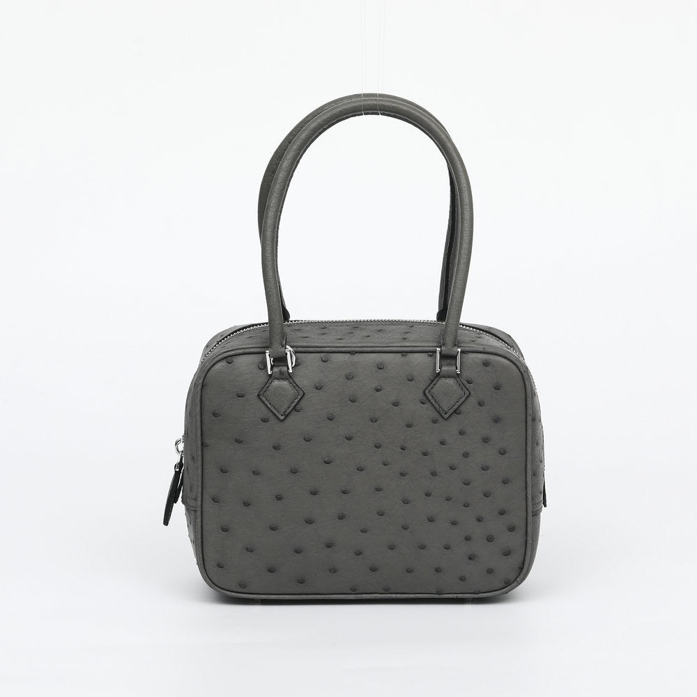 Rossie Viren women's genuine ostrich skin leather handbag with top handle, showcasing its textured, luxurious design.