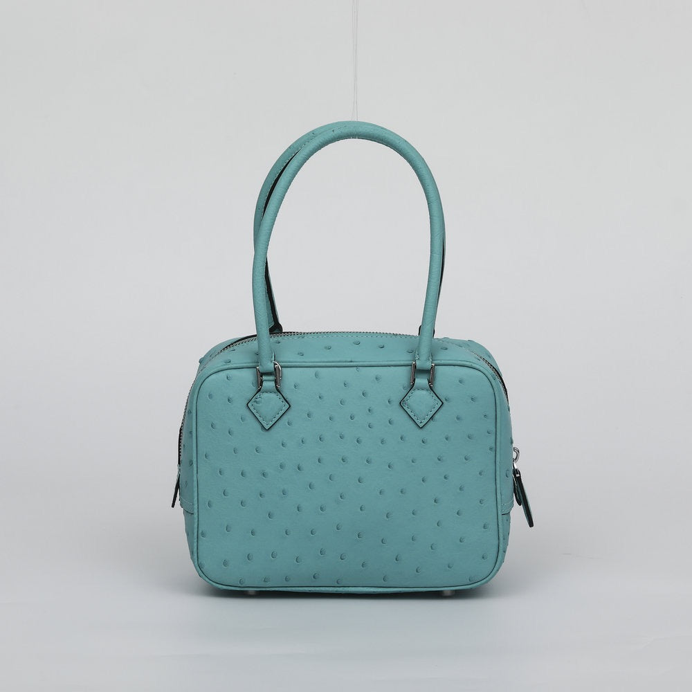 Women's genuine ostrich skin leather top handle handbag by Rossie Viren, featuring a sleek design and top handle detail.