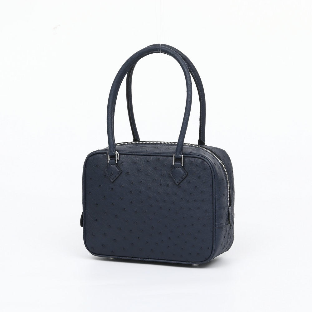 Women's Rossie Viren genuine ostrich skin leather handbag with top handle and structured design, showcasing luxury craftsmanship.