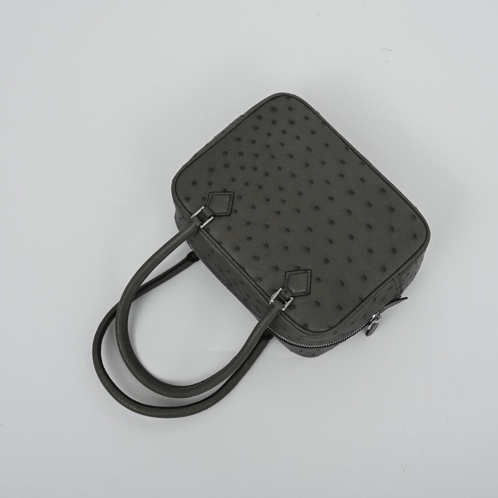 Rossie Viren women's genuine ostrich skin leather top handle handbag with elegant design and structured silhouette.