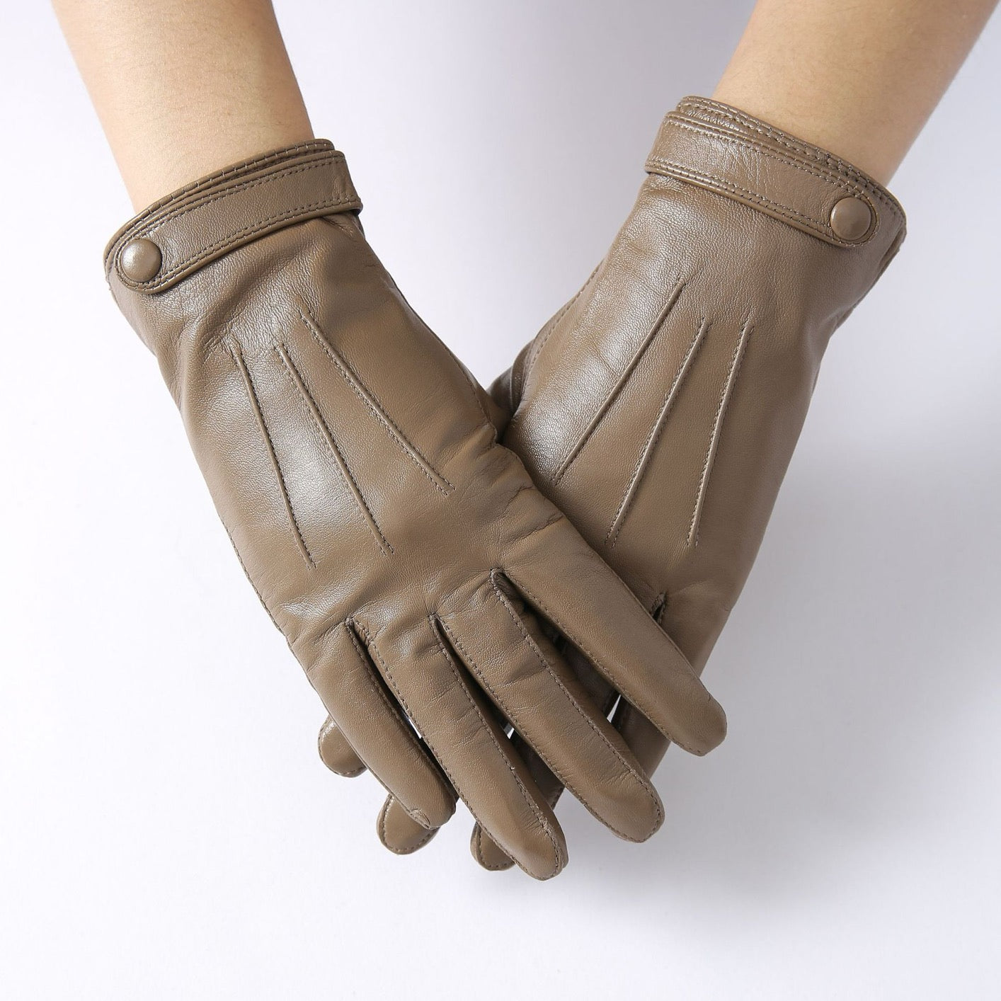 Women's soft goatskin leather fashion snap cuff gloves in black, with stylish design and metal snap details.