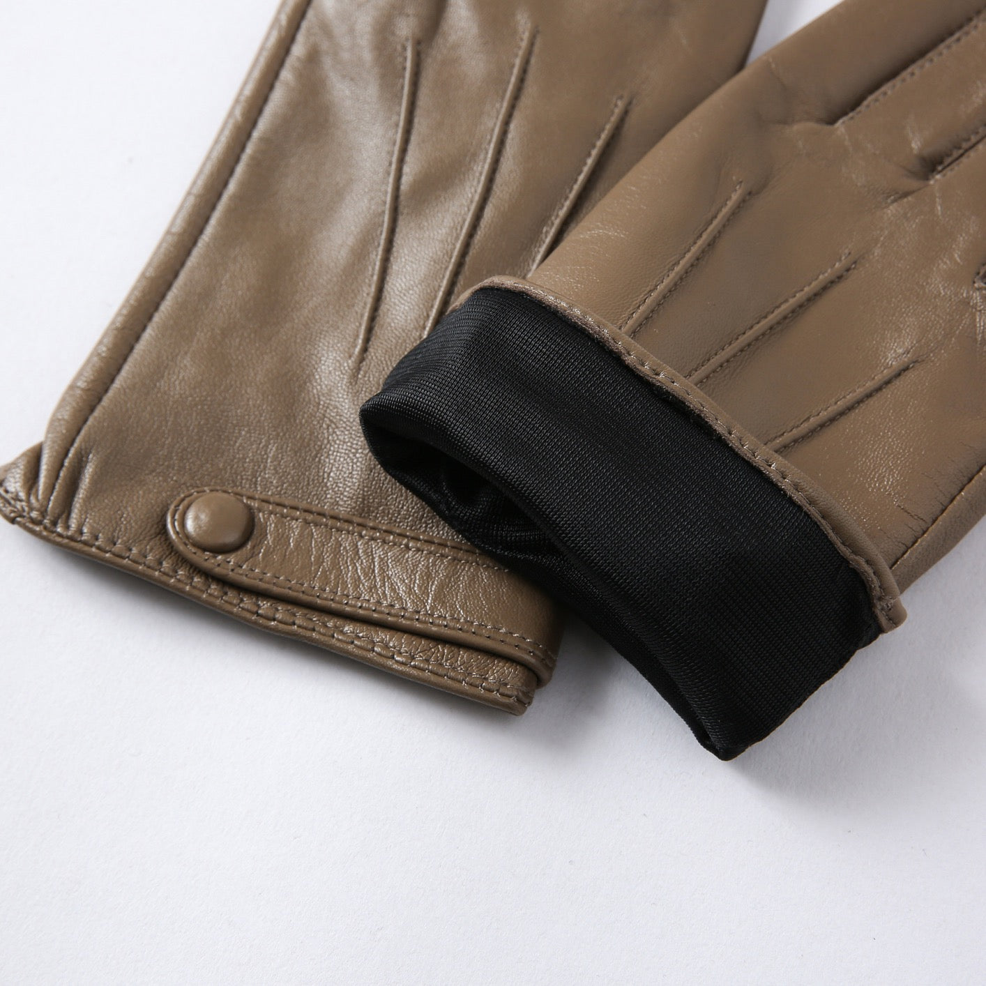 Women's soft goatskin leather fashion snap cuff gloves with stylish detailing, designed by Rossie Viren.