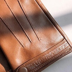 Women's soft goatskin leather fashion snap cuff gloves, stylish and elegant, shown in close-up detail.