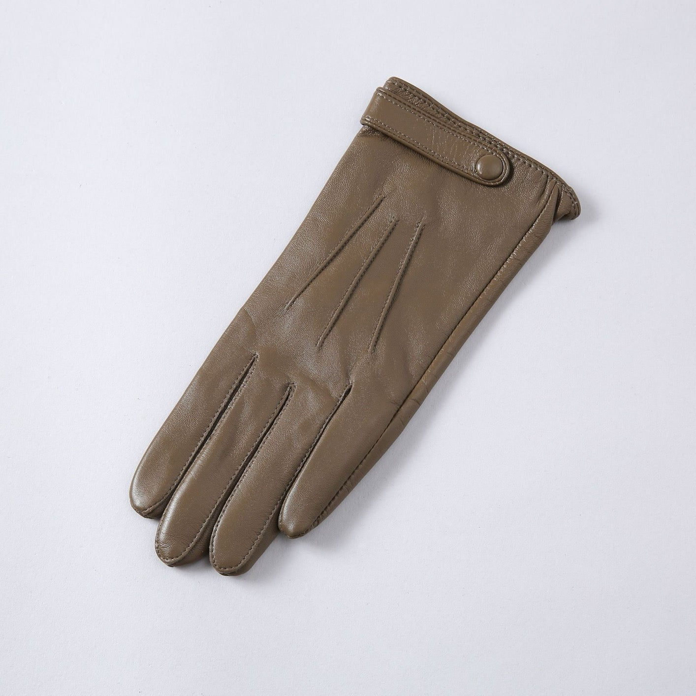 Women's soft goatskin leather cuff gloves from Rossie Viren, featuring a fashionable snap closure and stylish design.
