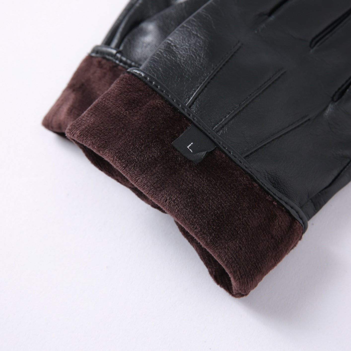 Women's soft goatskin leather fashion snap cuff gloves with elegant design, featuring a stylish cuff detail and smooth leather finish.