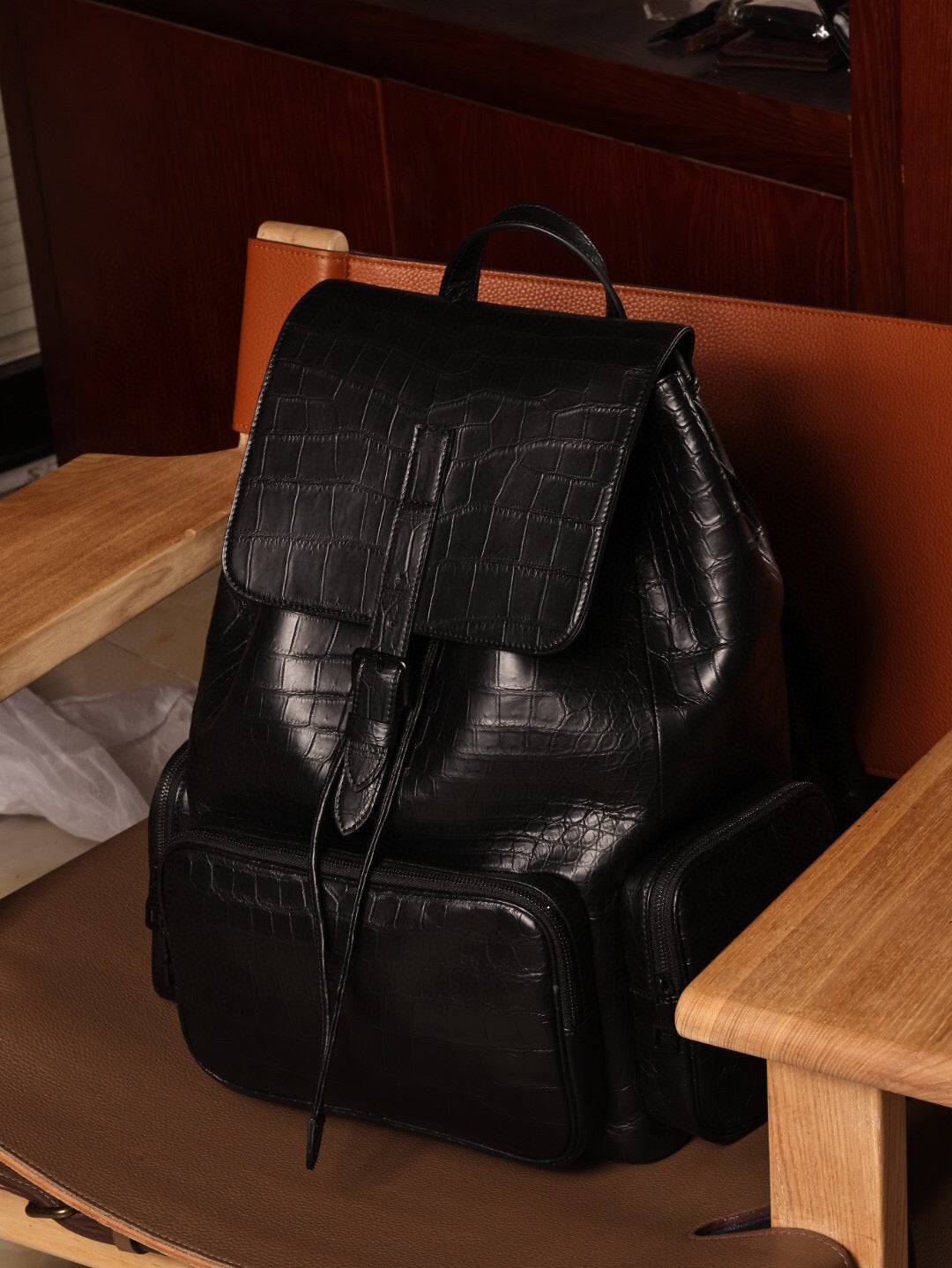 Unisex black crocodile leather backpack handbag with adjustable straps and silver hardware from Rossie Viren.