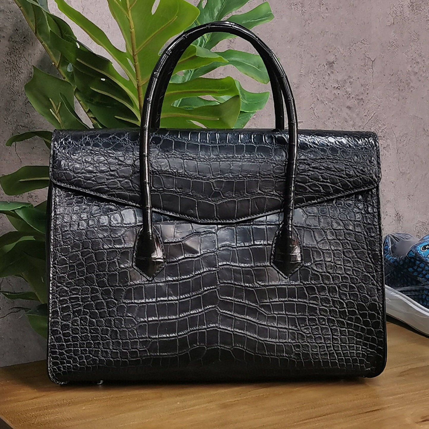 Rossie Viren crocodile skin leather briefcase with sturdy handle and sleek design, ideal for business and laptop storage.