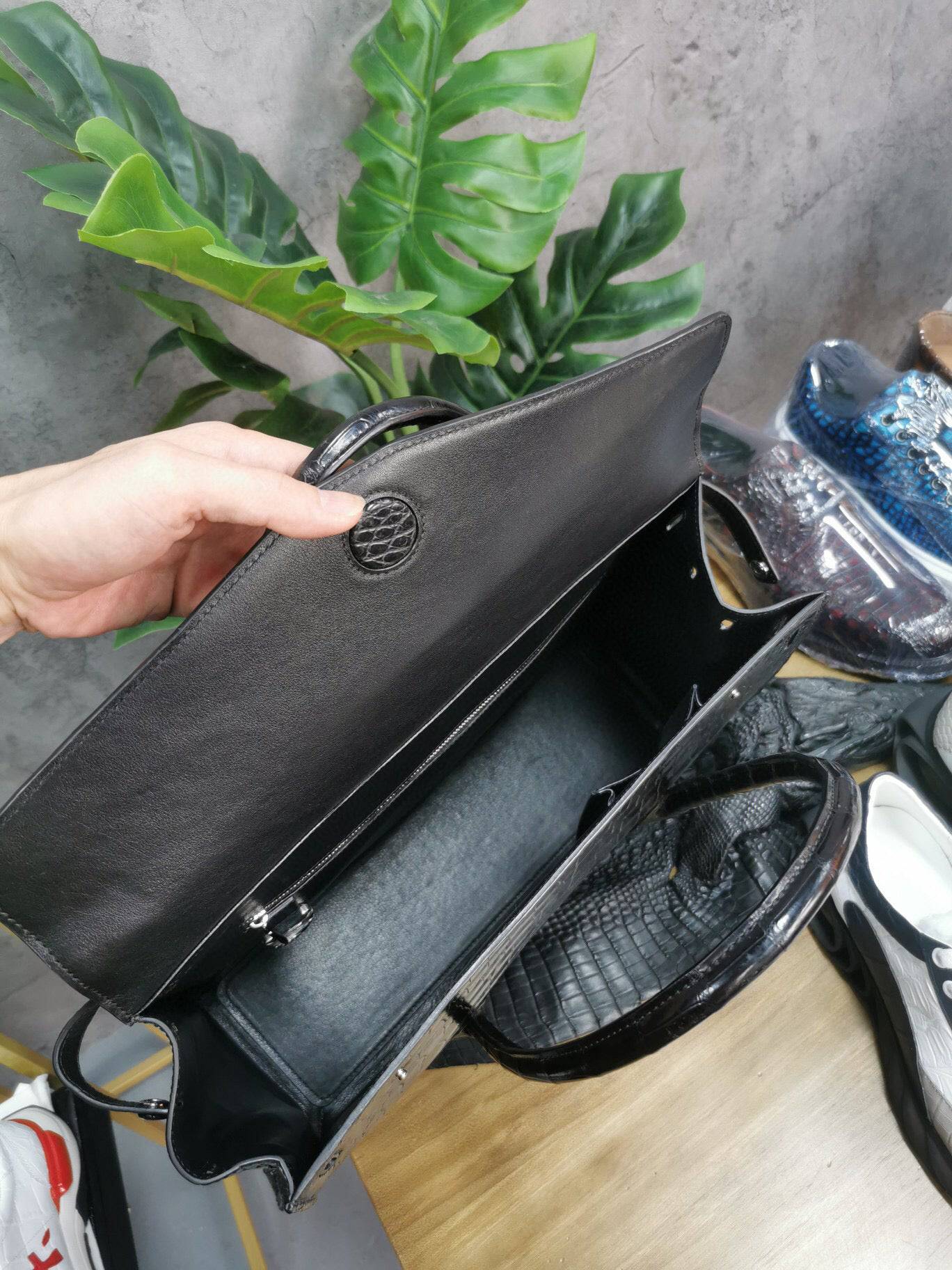 Rossie Viren crocodile skin leather briefcase with sturdy handle, designed for business laptops and professional use.