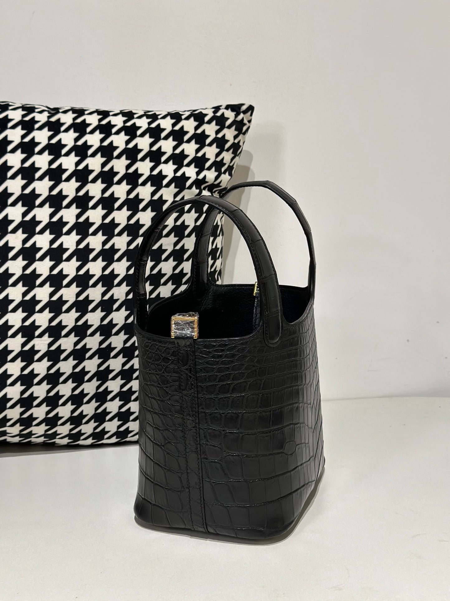 Women's black genuine crocodile leather small crossbody handbag by Rossie Viren with a sleek, textured crocodile skin surface.