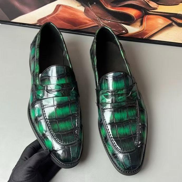 Vintage green crocodile leather loafers by Rossie Viren featuring classic slip-on design and textured crocodile pattern.