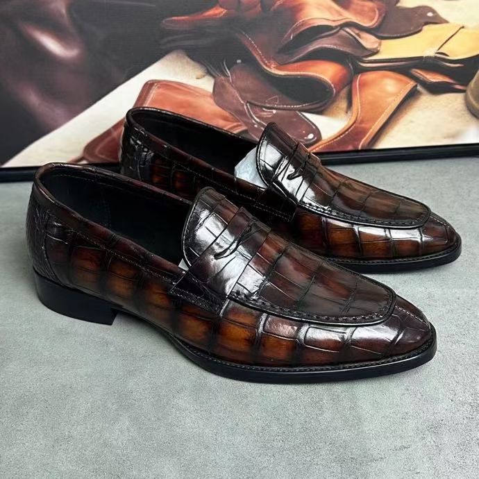 Vintage brown crocodile leather loafer shoes by Rossie Viren, featuring detailed crocodile skin texture and classic slip-on design.