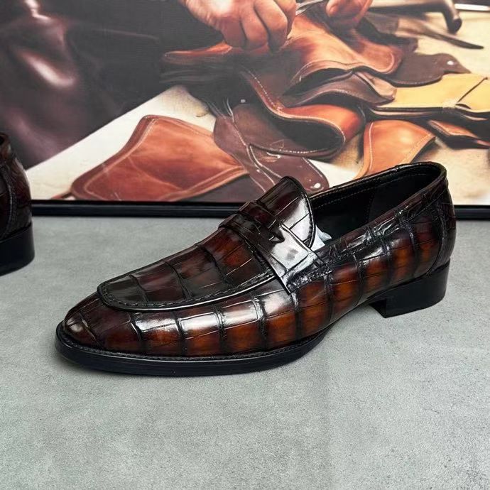 Vintage brown crocodile leather loafer shoes by Rossie Viren featuring detailed crocodile skin texture and classic slip-on design.