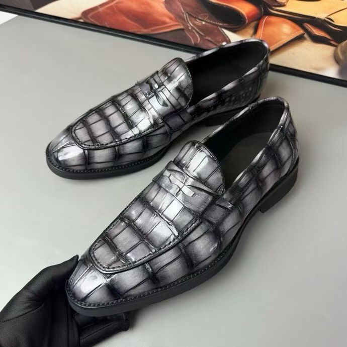 Vintage grey crocodile leather loafer shoes by Rossie Viren, showcasing sleek design and textured crocodile pattern.