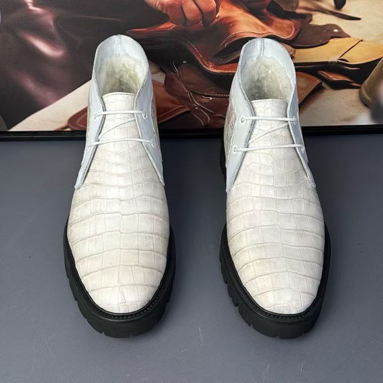 Genuine crocodile leather boots by Rossie Viren featuring textured crocodile pattern and ankle-high design.