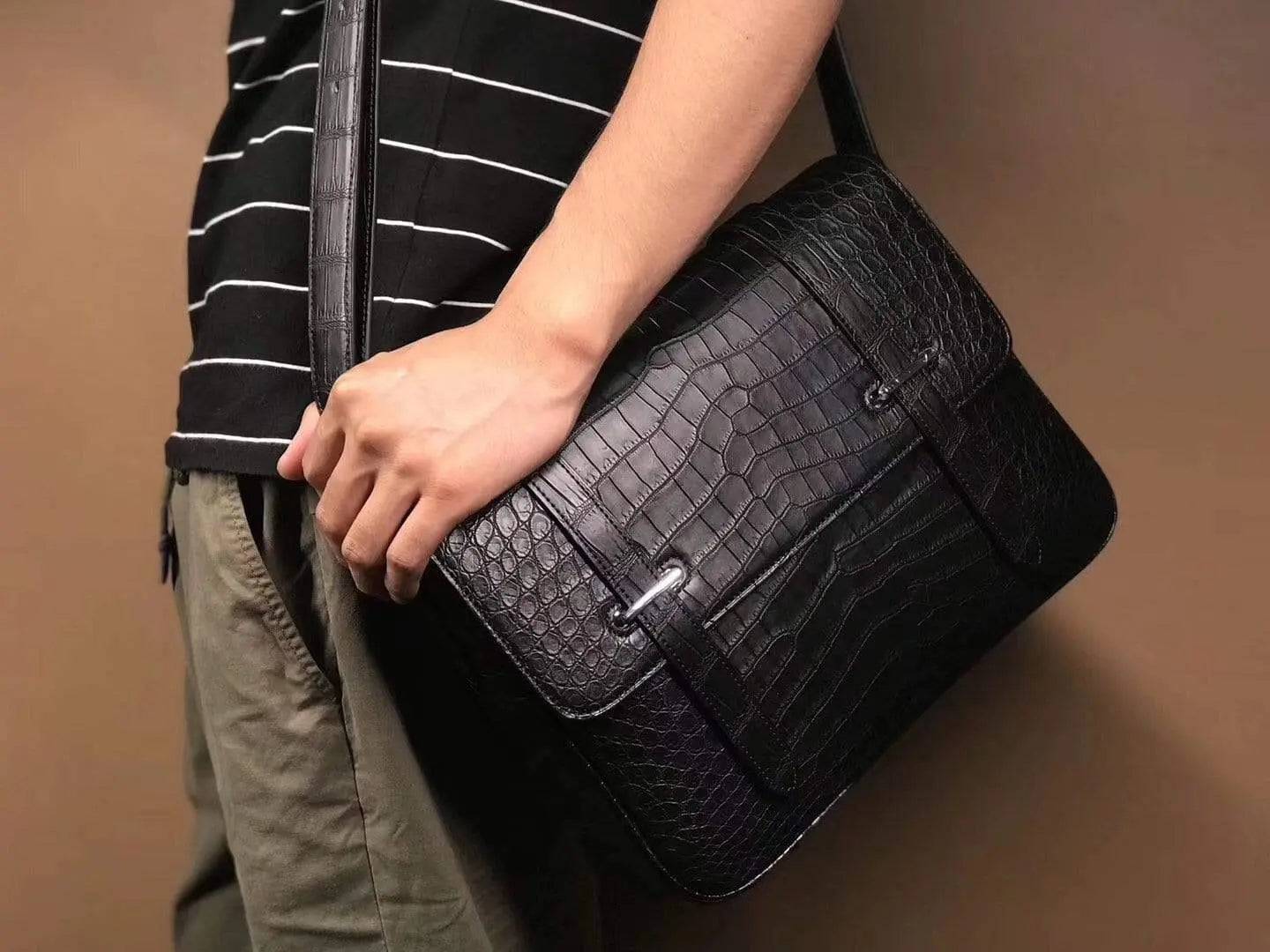 Matt washed genuine crocodile leather messenger bag by Rossie Viren, with shoulder strap and sleek postman style for men and women.