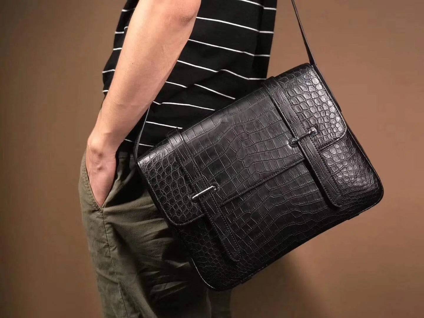Matt washed genuine crocodile leather messenger bag by Rossie Viren, featuring a sleek design for men and women.