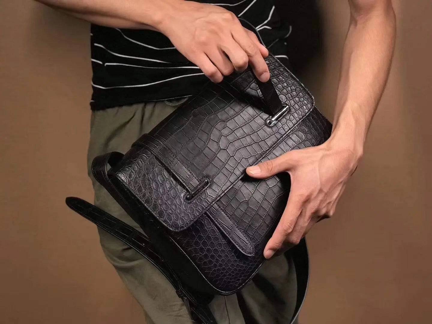 Matt washed genuine crocodile leather messenger bag by Rossie Viren, featuring a sleek shoulder postman style for men and women.