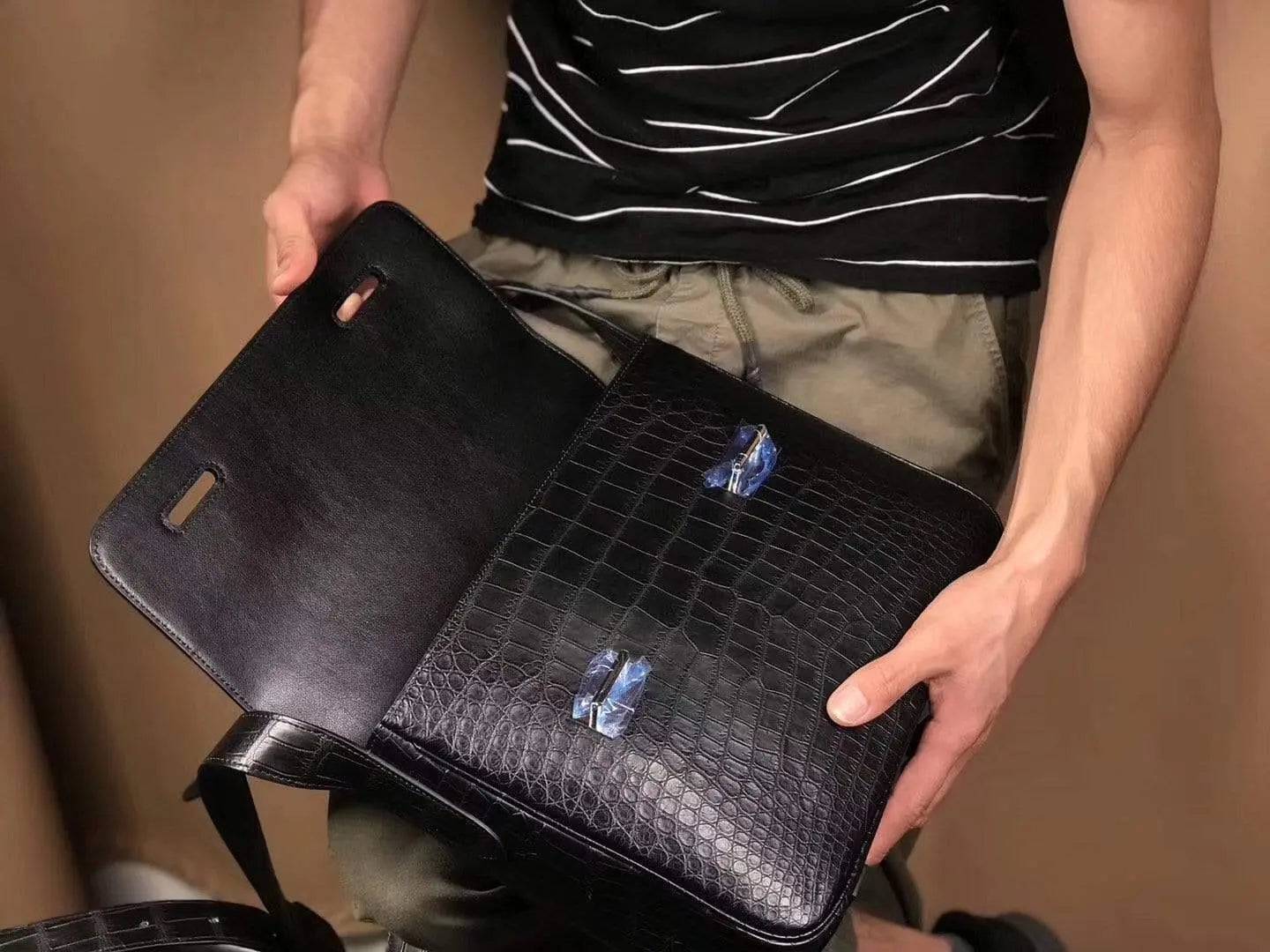 Matt washed genuine crocodile leather messenger bag by Rossie Viren, featuring a sleek design for men and women.