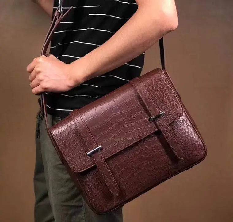 Matt-washed genuine crocodile leather messenger bag by Rossie Viren, with shoulder strap and sleek postman style for men and women.