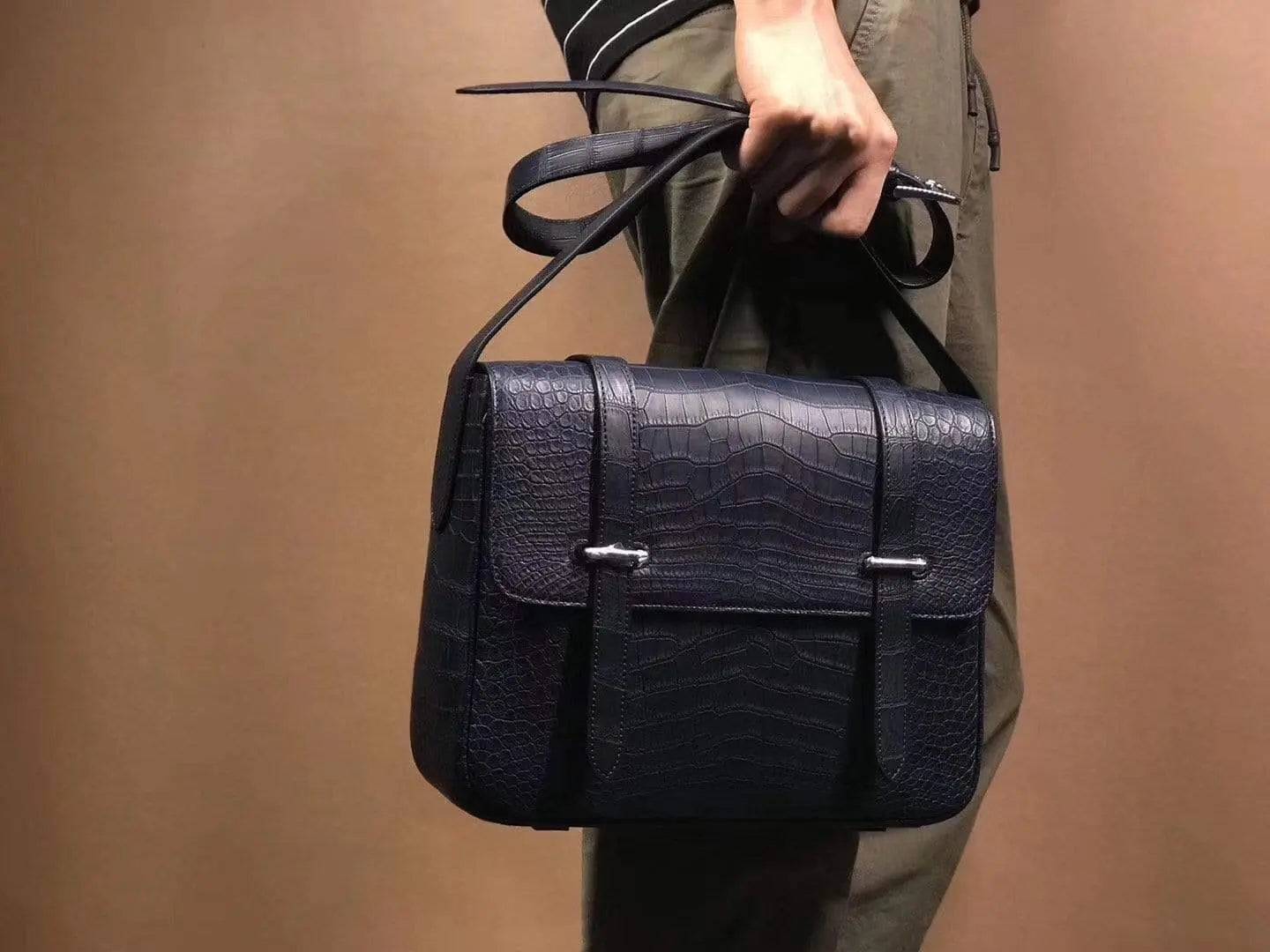 Matt washed genuine crocodile leather messenger bag with shoulder strap, designed for men and women, by Rossie Viren.