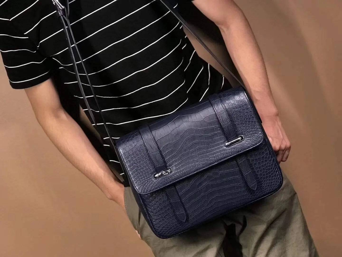 Matt washed genuine crocodile leather messenger handbag by Rossie Viren, featuring a sleek shoulder strap for men and women.