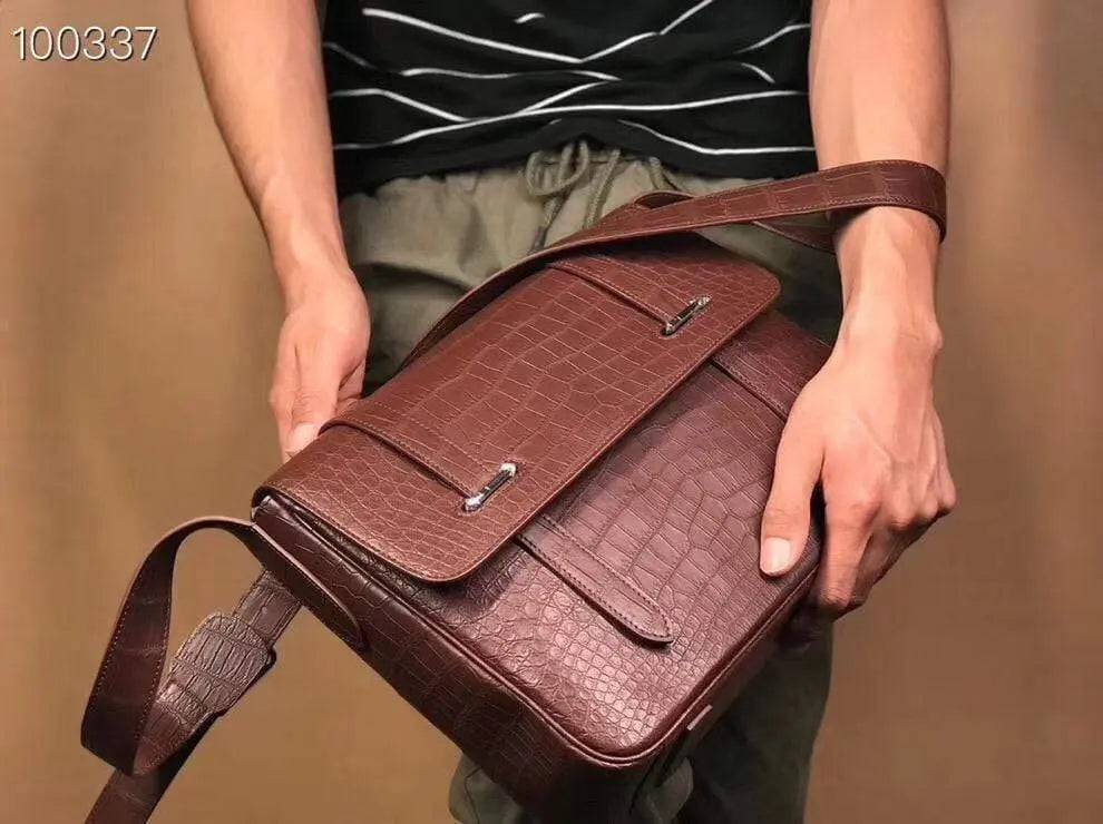 Matt washed genuine crocodile leather messenger handbag by Rossie Viren, featuring a sleek shoulder strap and classic postman style.