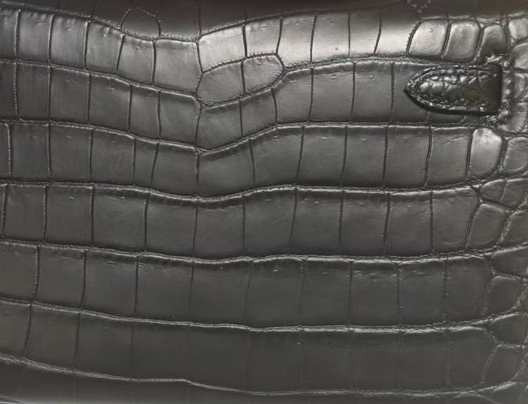 Rossie Viren black crocodile leather card holder with sleek, textured surface, designed for stylish cigarette case storage.