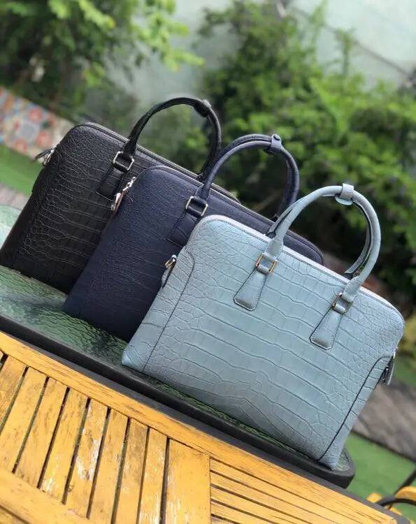 Men's crocodile leather laptop bag briefcase by Rossie Viren, featuring a sleek, professional handbag design with a textured crocodile pattern.
