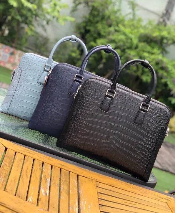 Men's crocodile leather laptop bag briefcase by Rossie Viren, featuring a sleek, professional handbag design with multiple compartments.