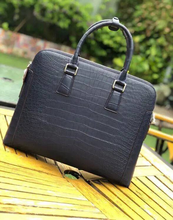 Men's crocodile leather laptop bag briefcase by Rossie Viren, featuring a sleek, structured handbag design with a top handle and secure closure.