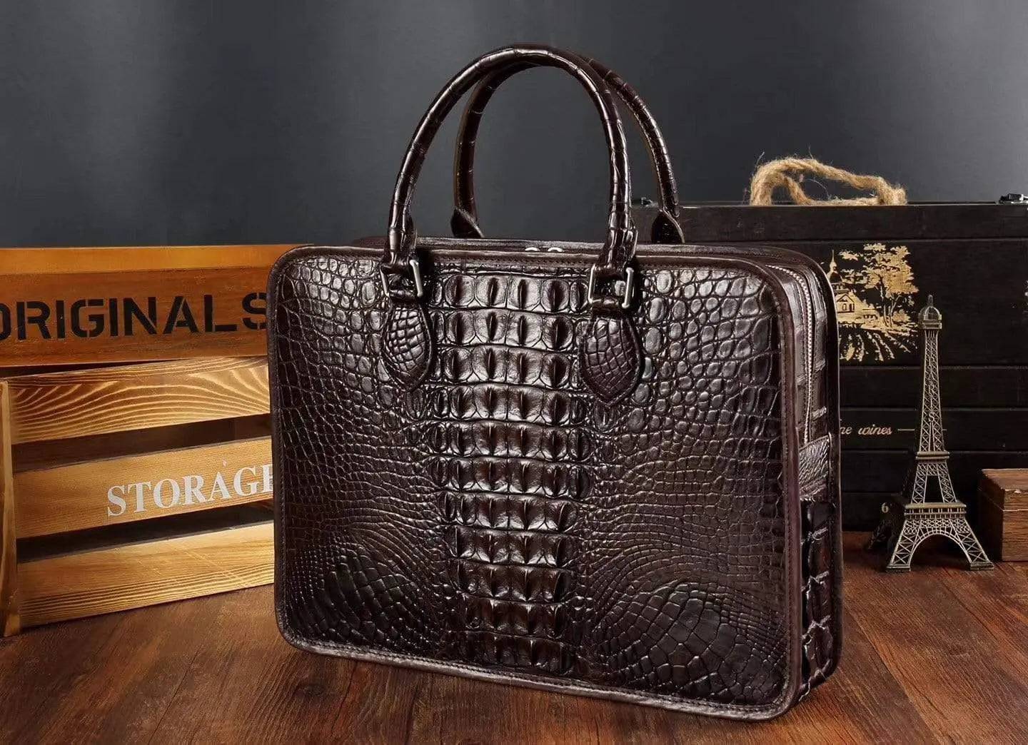 Men's crocodile leather briefcase by Rossie Viren with top handle, structured handbag with textured crocodile pattern.