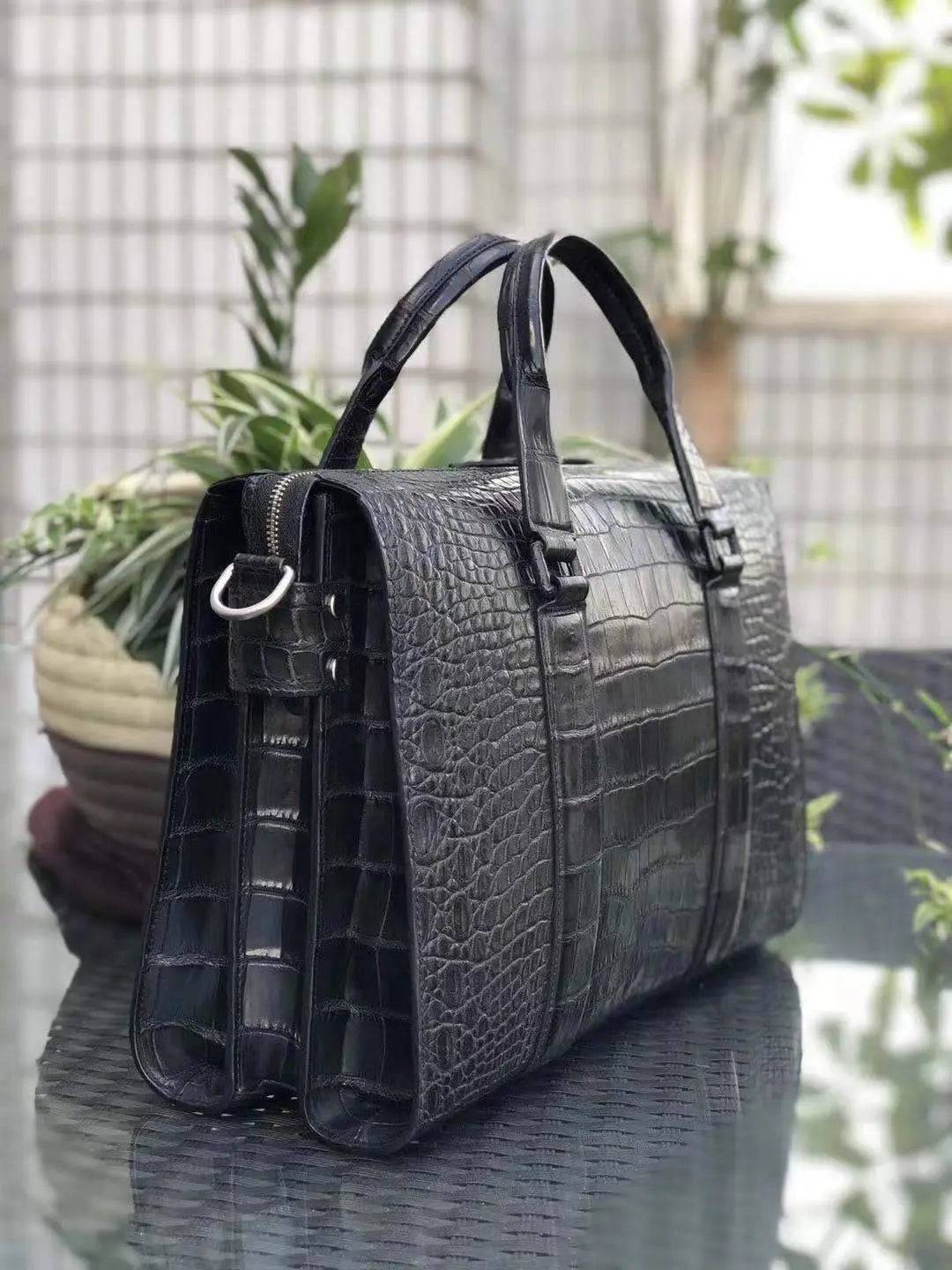 Men's crocodile leather doctor handbag with laptop compartment by Rossie Viren, featuring a structured rectangular design and top handles.
