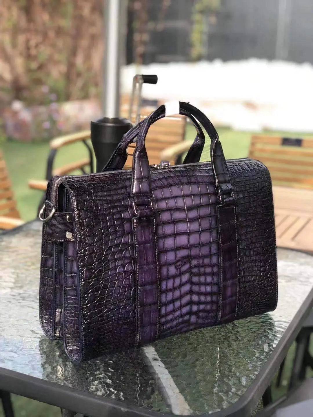 Men's crocodile leather doctor bag and laptop handbag by Rossie Viren with sturdy handles and structured design.