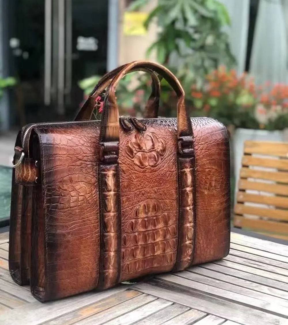 Men's crocodile leather doctor bag by Rossie Viren, featuring a spacious laptop compartment and classic handbag design.