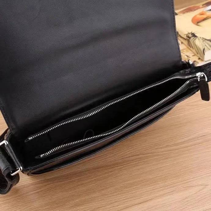 Mens crocodile leather messenger bag for laptop, crocodile crossbody bag with adjustable strap and rugged crocodile texture.