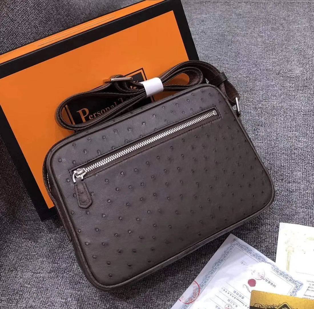 Mens messenger bag made of ostrich leather with crossbody strap, by Rossie Viren, featuring a stylish handbag design.