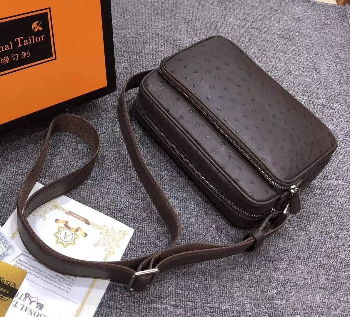 Mens messenger bag made of ostrich leather with cross-body shoulder strap by Rossie Viren, featuring a stylish handbag design.