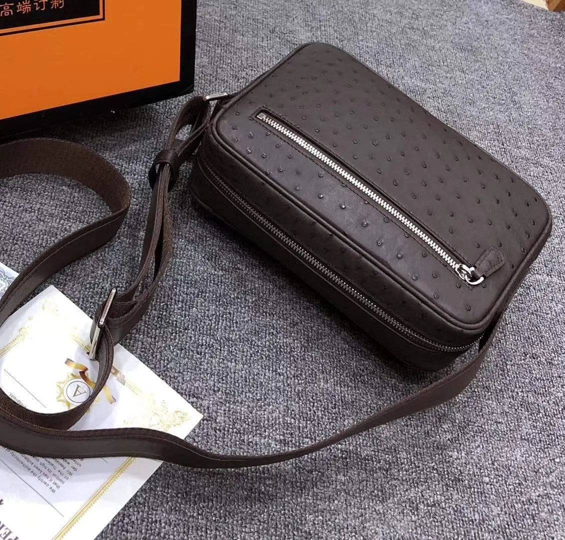 Men's messenger bag made of ostrich leather from Rossie Viren, featuring a cross-body shoulder design with multiple compartments.