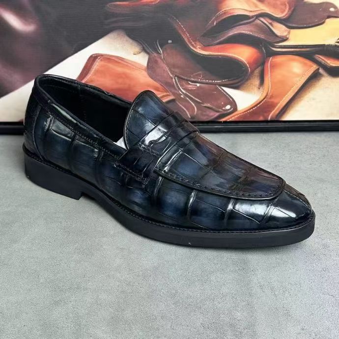 Vintage dark grey crocodile leather loafers by Rossie Viren, showcasing a sleek design with textured crocodile pattern.
