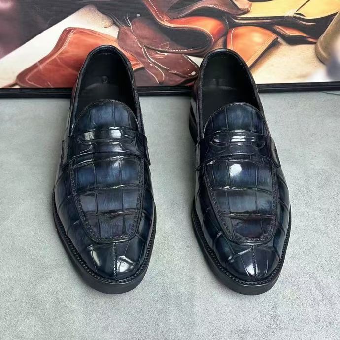 Dark grey vintage crocodile leather loafers by Rossie Viren, featuring a classic slip-on design and textured crocodile pattern.