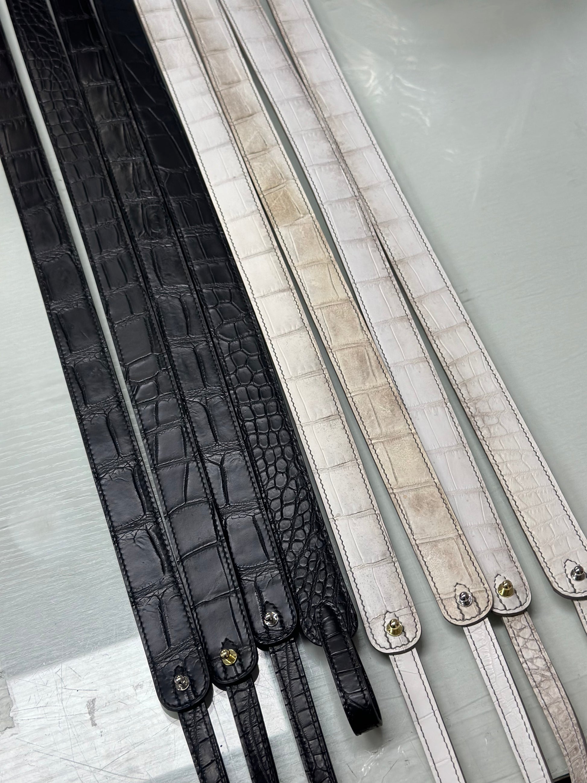 Women's black genuine crocodile leather crossbody handbag by Rossie Viren with a compact, stylish design.