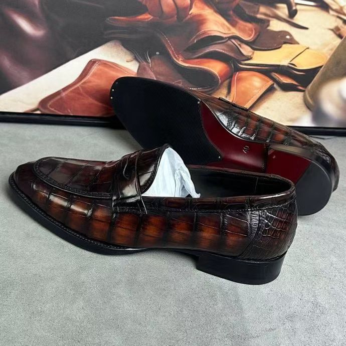 Vintage brown crocodile leather loafer shoes by Rossie Viren, featuring detailed crocodile texture and classic slip-on design.
