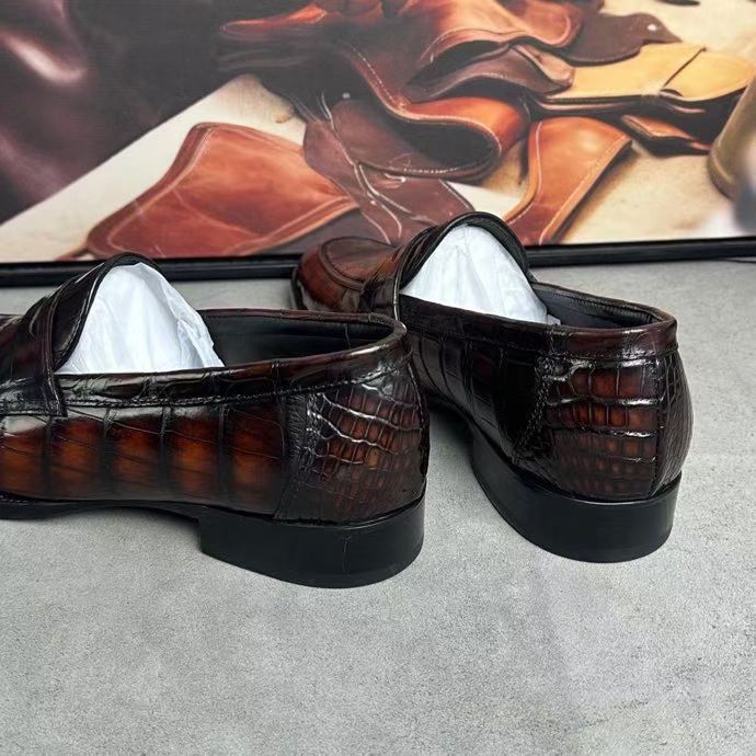 Vintage brown crocodile leather loafer shoes by Rossie Viren, featuring detailed crocodile texture and classic slip-on style.