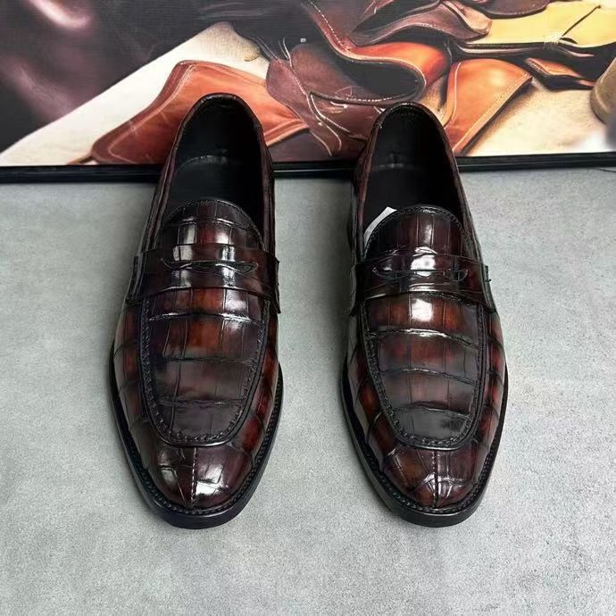 Vintage brown crocodile leather loafer shoes by Rossie Viren, showing detailed crocodile texture and classic slip-on design.