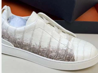 Rossie Viren crocodile skin leather sneakers showing detailed crocodile texture and stylish design.
